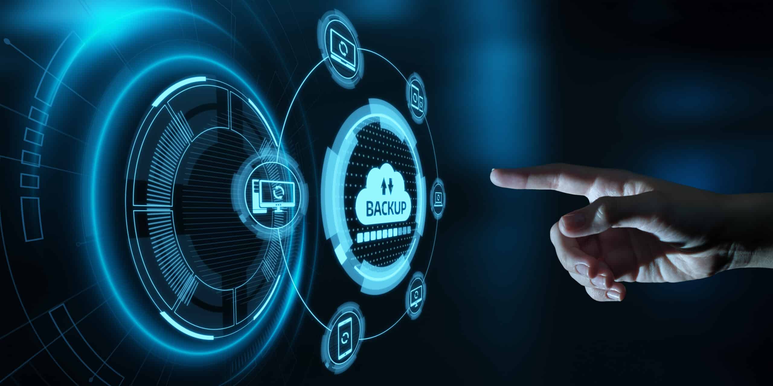 A hand points to a futuristic digital interface displaying interconnected icons centered around a large "Backup" symbol, emphasizing data security and backup technology vital for businesses' recovery plans.
